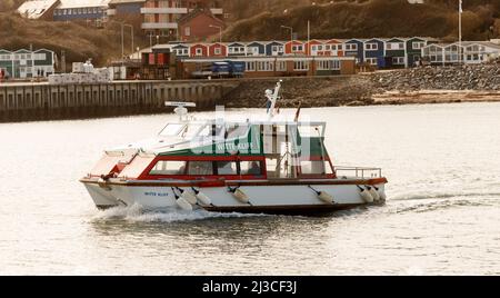 Helgoland, Germany. 26th Mar, 2022. Helgoland's dune ferry 'Witte Kliff' regularly shuttles between the main island and Helgoland dune. Credit: Markus Scholz/dpa/Alamy Live News Stock Photo