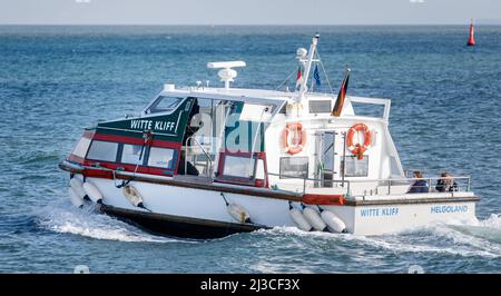 Helgoland, Germany. 26th Mar, 2022. Helgoland's dune ferry 'Witte Kliff' regularly shuttles between the main island and Helgoland dune. Credit: Markus Scholz/dpa/Alamy Live News Stock Photo