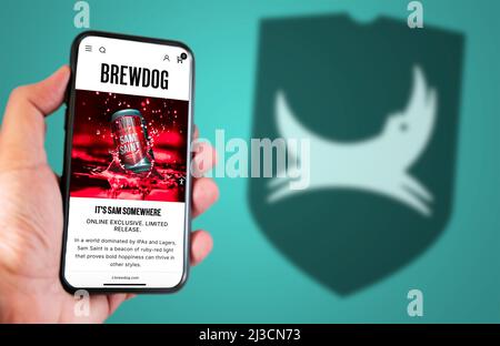 Ellon, Scotland, May 2022: The home page of the site Brewdog on the screen of a mobile phone. The mobile phone is held by a male hand. The company log Stock Photo