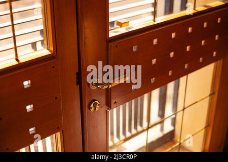 Detail of Wooden door with stained glass windows Stock Photo