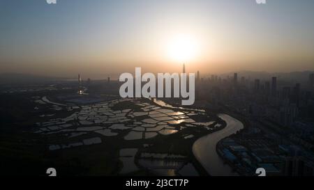 Shenzhen skyline view from the boundary of Hong Kong fish farm Stock Photo