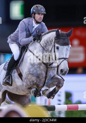 Leipzig, Germany. 07th Apr, 2022. Christian Kukut from Germany competes on Checker in the 1st Final of the Longines Fei Jumping World Cup at the Leipzig Fair. Credit: Jan Woitas/dpa/Alamy Live News Stock Photo