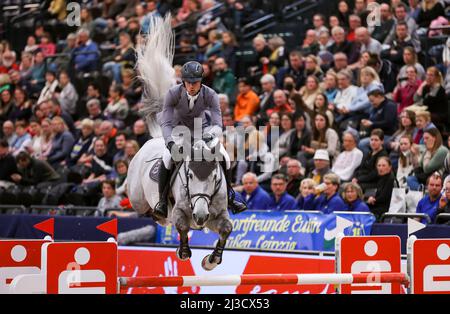 Leipzig, Germany. 07th Apr, 2022. Christian Kukut from Germany competes on Checker in the 1st Final of the Longines Fei Jumping World Cup at the Leipzig Fair. Credit: Jan Woitas/dpa/Alamy Live News Stock Photo