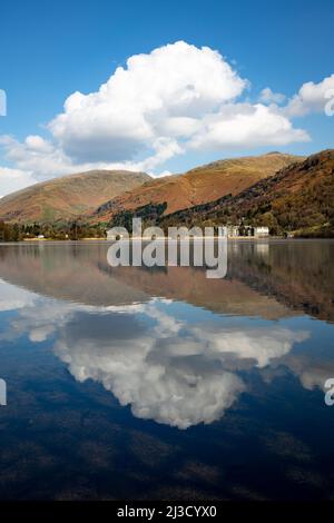 Landscape Reflections of clouds and blue sky in Grasmere Lake in The lake District national Park Stock Photo