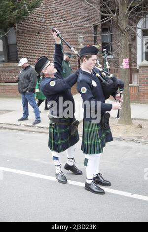 Xaverian High School Bagpipe musician getting his pipes tuned up before marching in the Saint Patrick's Day Parade in Bay Ridge, Brooklyn, New York. Stock Photo