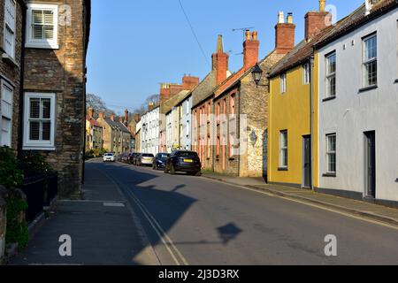 Old Georgian stone built houses on St Thomas Street, Wells, Somerset, a main road into the city Stock Photo