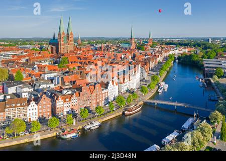 Aerial view over the river Trave and old sailing ships and boats in the old town of the Hanseatic City of Lübeck, Schleswig-Holstein, Germany Stock Photo