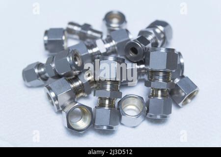 Quick connect fittings coupling for assembling compressed air, hydraulics, pneumatics, gases, fuel lines.Close up. Selective focus. Stock Photo