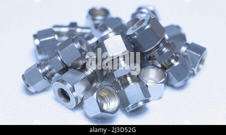 Quick connect fittings coupling for assembling compressed air, hydraulics, pneumatics, gases, fuel lines.Close up. Selective focus. Stock Photo