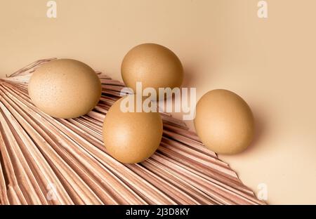 Golden dyed Easter eggs on beige background. Celebration of religious holiday concept. Organic farm eco food. High quality photo Stock Photo