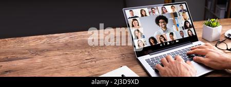 Man Working From Home Having Online Group Videoconference On Laptop Stock Photo