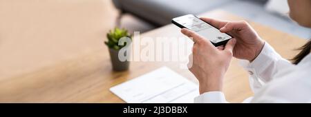 Taking Invoice Document Photo Using Phone Or Smartphone Stock Photo
