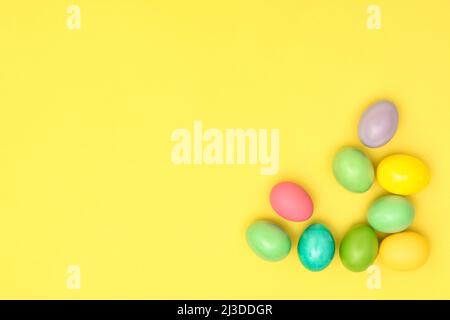 Easter eggs decoration on yellow paper background Stock Photo