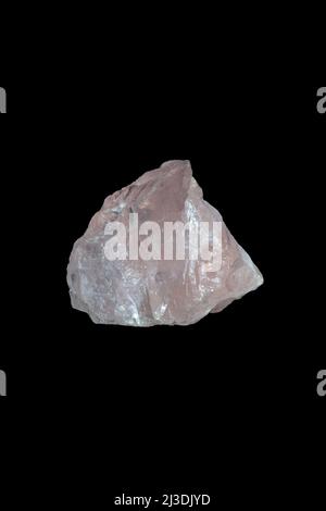 Rose quartz, mineral stone on black background. Stock Photo