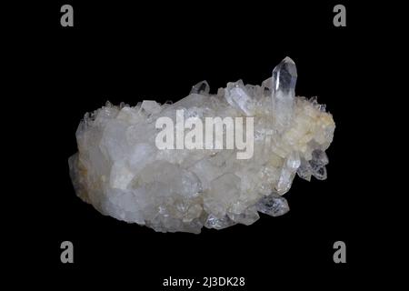 Quartz crystal, translucent mineral stone on black background. Stock Photo