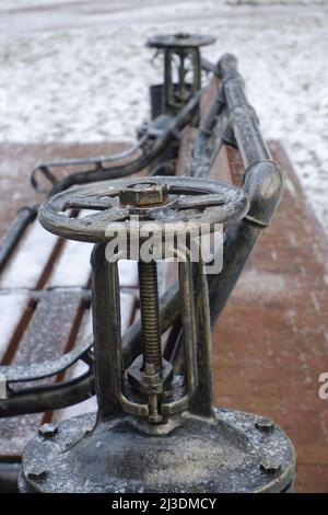 Steampunk-style water pump with valves and pressure gauges. Stock Photo