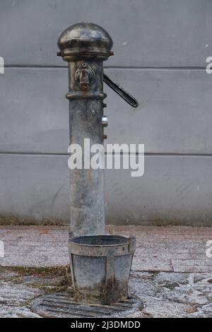 Rusty old valves, gauges and metal parts on an antique steam locomotive ...