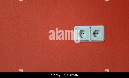 Electric outlets on painted wall Stock Photo