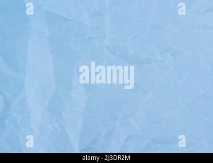 Wrinkled sheet of light blue paper. Textured backdrop. Stock Photo