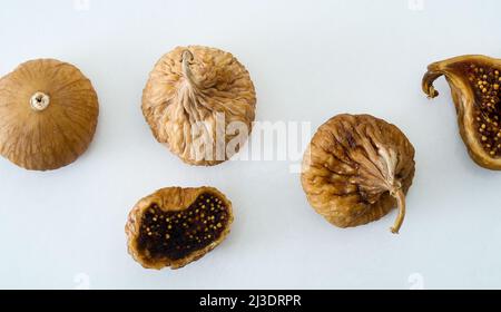 Close up photo of dried figs on isolated white background. Stock Photo
