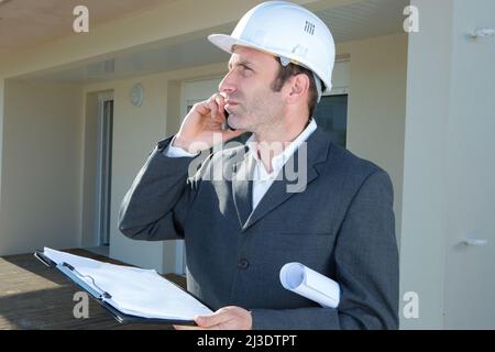 worker construction engineer on the phone Stock Photo