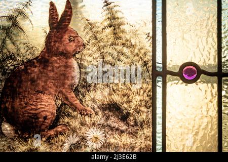 Vintage stained glass illustration of a rabbit in a field Stock Photo