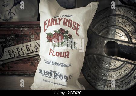 Vintage flour sack and bread making equipment in the 1920s or 1930s Stock Photo