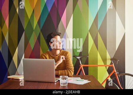 Thinking about creative ways to expand the business. Shot of a creative employee working in a modern office. Stock Photo