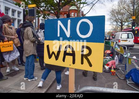 London, UK. 7th April 2022. 'No War' sign outside the embassy. Hundreds of people gathered outside the Russian Embassy and dumped pans, clothing, toys, appliances and other household items, in response to the looting by Russian soldiers in Ukraine. Credit: Vuk Valcic/Alamy Live News Stock Photo