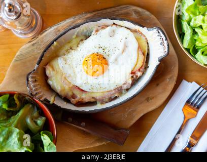 Swiss cheese crust with fried egg Stock Photo