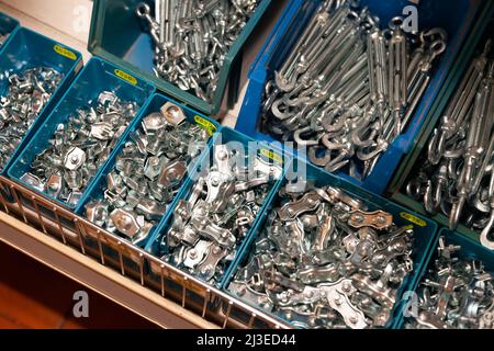 Boxes with building hardware in a hardware store Stock Photo