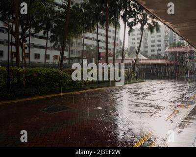 Rainy day in a quiet residential neighbourhood in the evening, during sunset Stock Photo