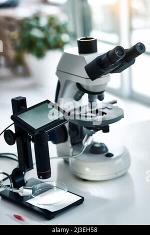 The equipment you need is ready. Still life shot of two microscopes placed in a laboratory. Stock Photo