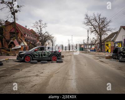 Bucha, Ukraine. 06th Apr, 2022. A view of a damaged car in Bucha. After the withdrawal of Russian troops. Ukrainians document horrible atrocities committed by Russian soldiers on the civilian population. People who survived several weeks of Russian occupation try to start a new life. (Photo by Jana Cavojska/SOPA Images/Sipa USA) Credit: Sipa USA/Alamy Live News Stock Photo