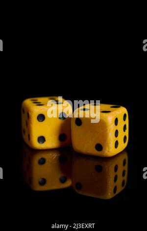Gambling. Two dice on a black background with reflection Stock Photo