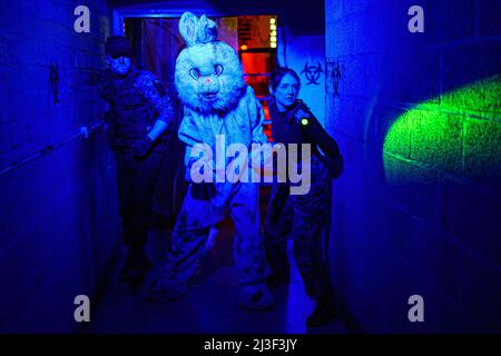 Zombie actors rehearse as they get into their roles inside Shepton Mallet prison, where characters are preparing for an immersive terror event taking place over the weekend with zombies and real-life scary characters in the old prison workshop building. Picture date: Thursday April 7, 2022. Stock Photo