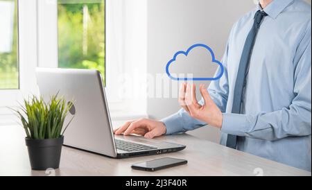 Businessman hand holding cloud.Cloud computing concept, close up of young business man with cloud over his hand.The concept of cloud service Stock Photo