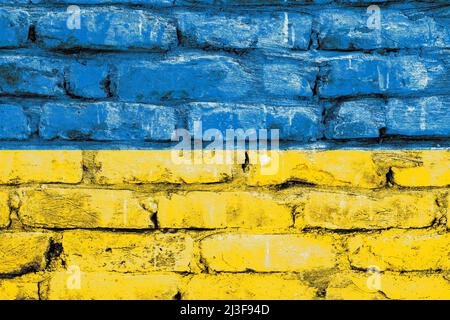 Distressed painted ukrainian flag on a brick structural old concrete wall surface Stock Photo