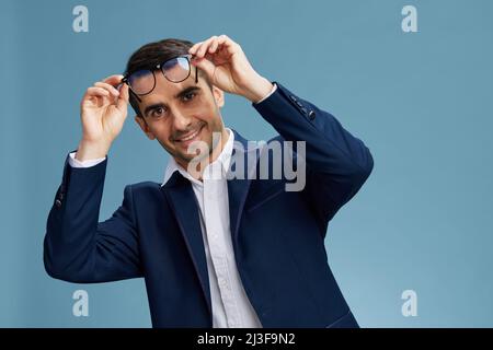smiling business man puts on glasses posing self-confidence business and office concept Stock Photo