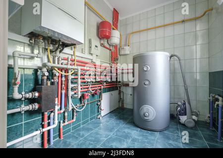 heating system in boiler room, gas and water supply system of house, measuring pressure and controlling temperature with sensors  for gas boiler with Stock Photo
