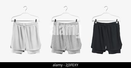 set of mockup templates for men's sports shorts with compression fittings on hangers. White, black and heather sportswear. Stock Photo