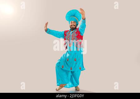 Sikh Man performing bhangra during Baisakhi Celebration Stock Photo