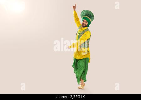 Sikh Man performing bhangra during Baisakhi Celebration Stock Photo