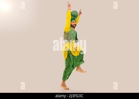 Sikh Man performing bhangra during Baisakhi Celebration Stock Photo