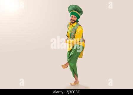 Sikh Man performing bhangra during Baisakhi Celebration Stock Photo