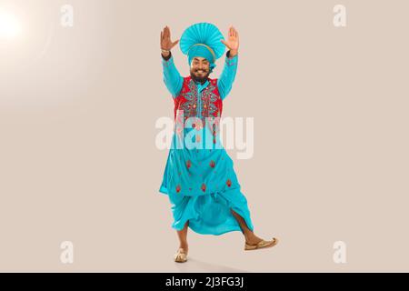 Sikh Man performing bhangra during Baisakhi Celebration Stock Photo