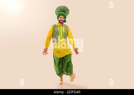 Sikh Man performing bhangra during Baisakhi Celebration Stock Photo