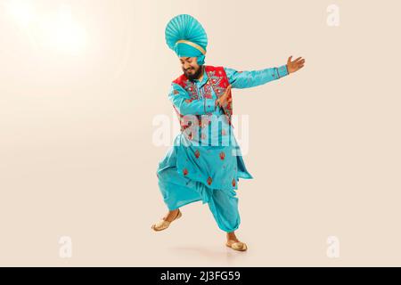 Sikh Man performing bhangra during Baisakhi Celebration Stock Photo