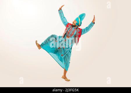 Sikh Man performing bhangra during Baisakhi Celebration Stock Photo