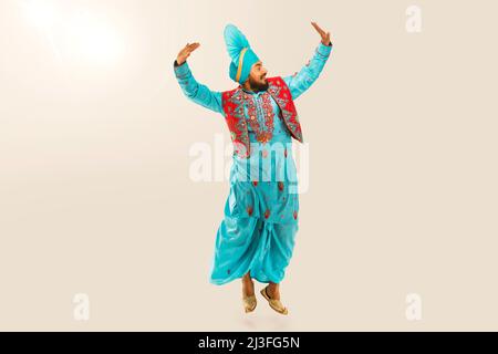 Sikh Man performing bhangra during Baisakhi Celebration Stock Photo